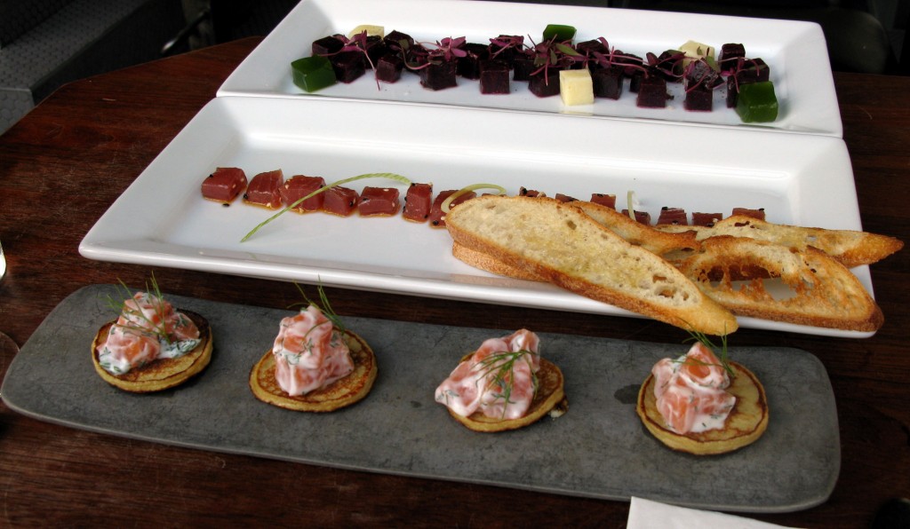 From top to bottom:  roasted beet, pecorino cheese, and basil jelly; tuna tartare spiced with piment d’Espelette and smoked paprika; and blini canapés of salmon gravlax and crème fraîche 