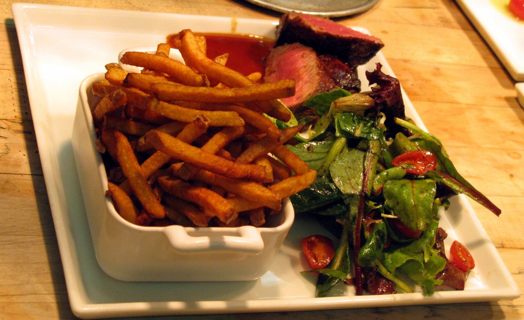 Beef sirloin with truffle sauce, pommes Pont-Neuf, and  jardinière salad